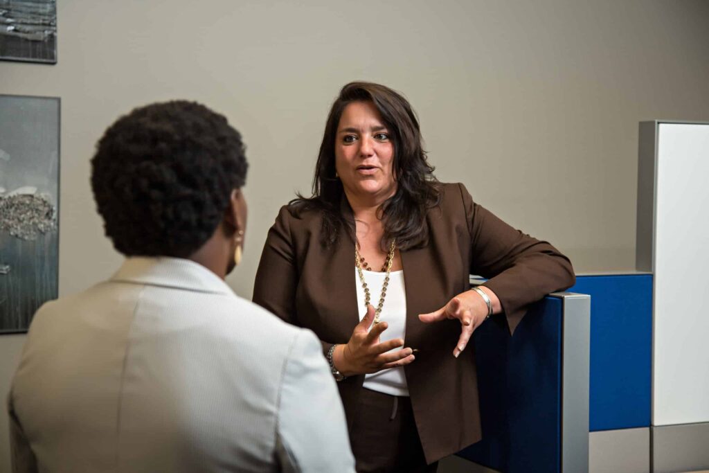 Sara Hornick talking with a Client